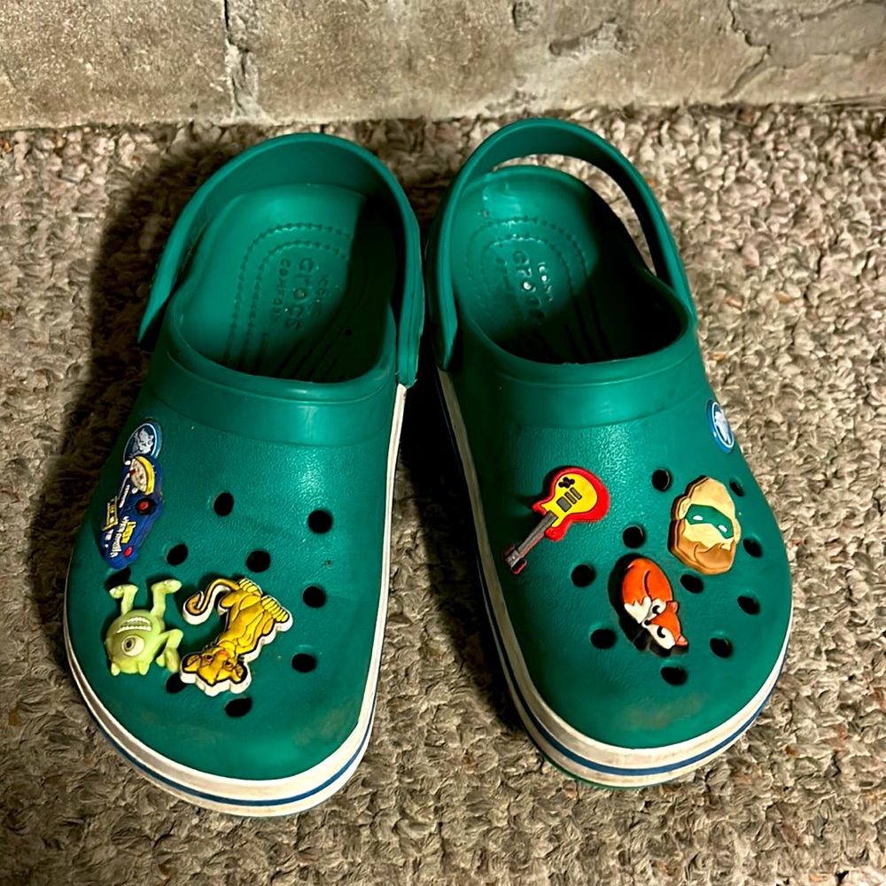 Green kids crocs with charms